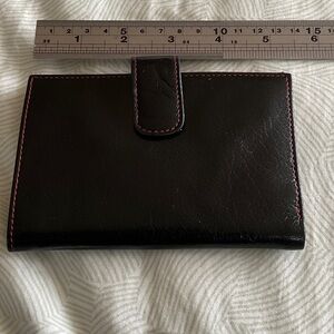 Black leather Tusk wallet.